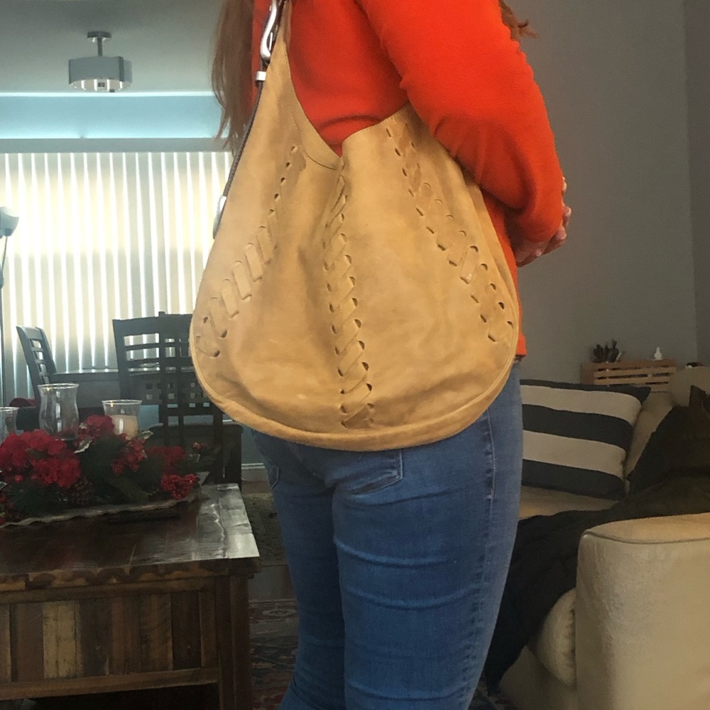 Hobo style bag .it is buttery smooth leather texture .